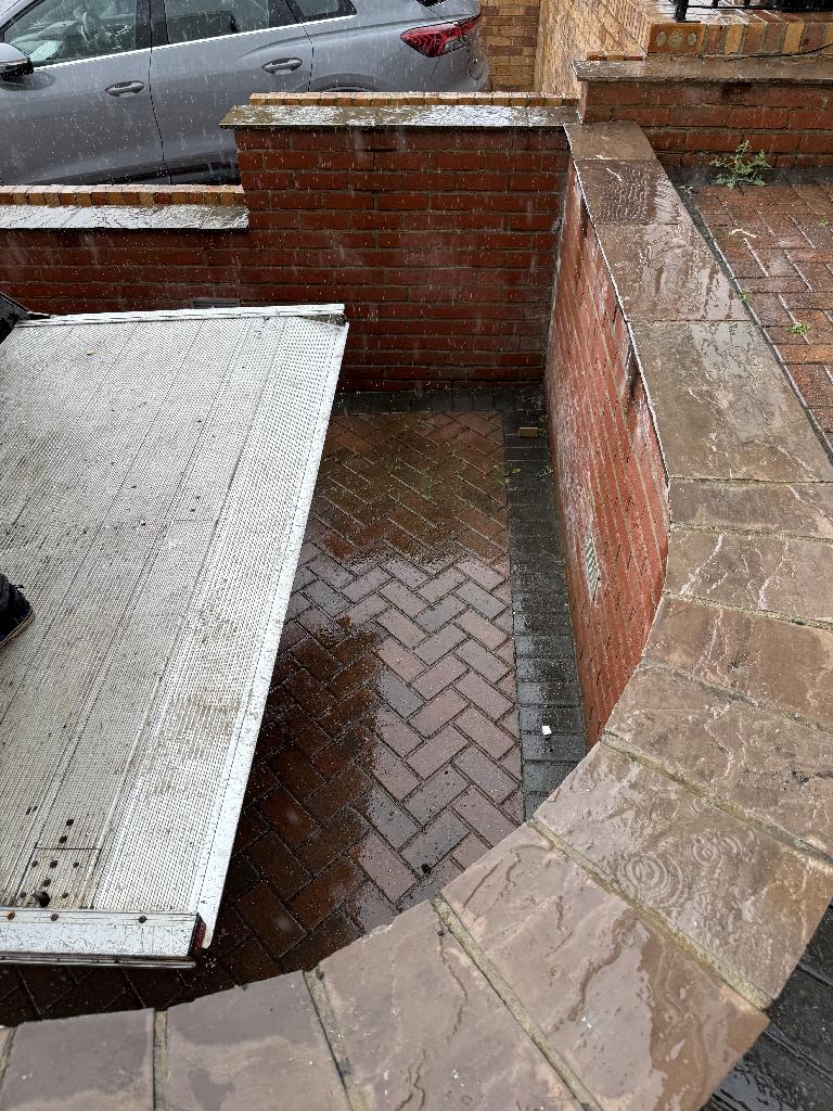 After u2013 cleared area, driveway looks tidy and accessible.